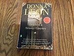 Cover of 'Death In A Strange Country' by Donna Leon